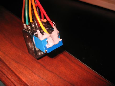 1995 Ford C-350 (Centurion Conversions) - An electrical relay with several wires attached, held together with a putty-like substance.