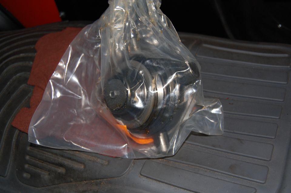 Part in plastic bag on floor mat