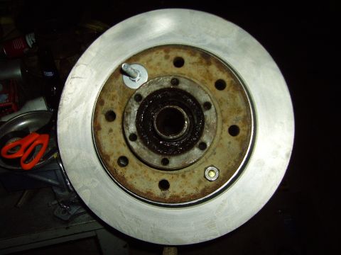 1991 Ford Bronco - Close-up of a brake rotor and hub assembly with visible bearing grease.