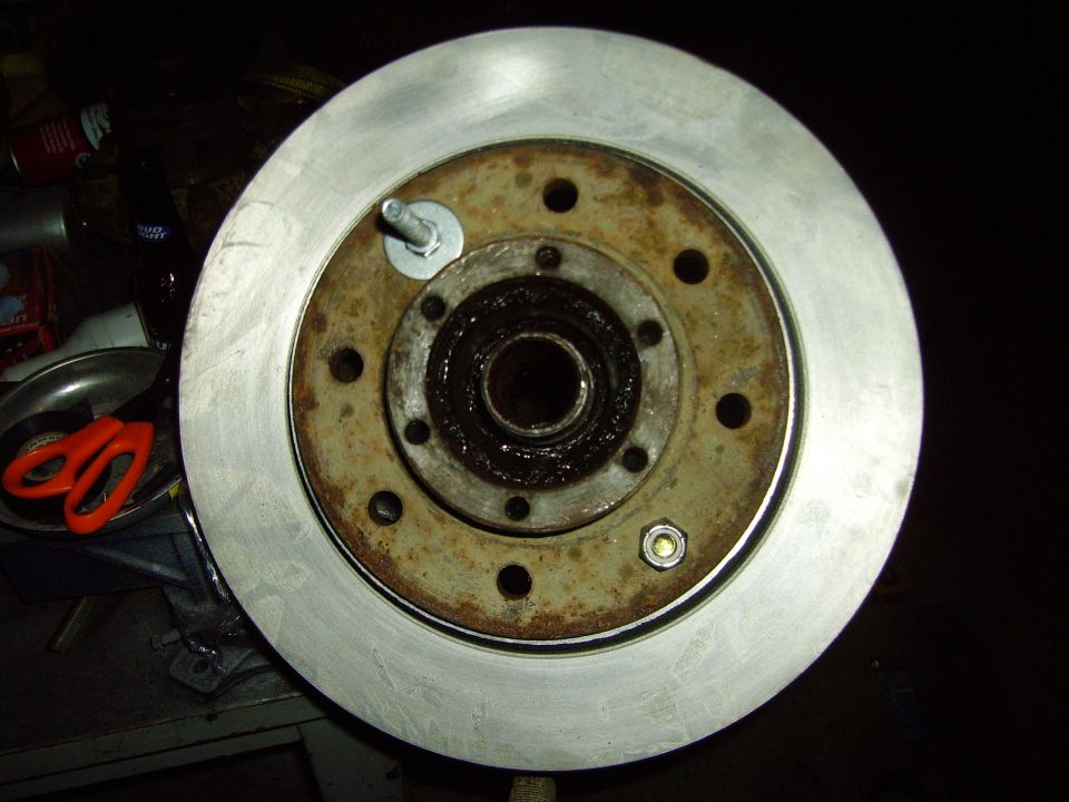 Brake rotor with hub and bearing assembly, showing rust and grease