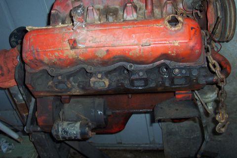 1994 Ford Bronco - Engine block and valve covers, likely from an older vehicle, showing signs of wear and rust.