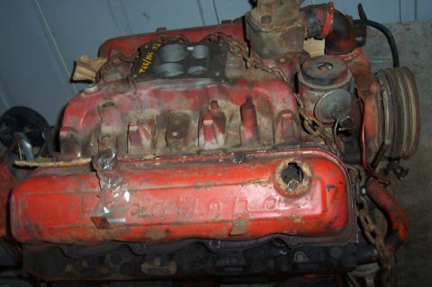 1994 Ford Bronco - A red V8 engine is shown, with visible rust and wear, suggesting it is a used or salvaged part.