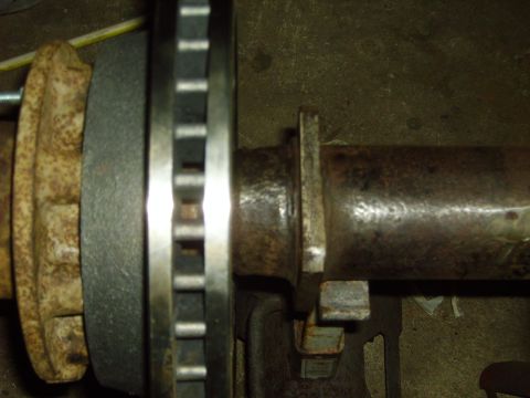 1991 Ford Bronco - Close-up view of a rear axle brake rotor and hub assembly.