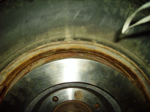 1991 Ford Bronco - This image shows a heavily rusted brake rotor, indicating significant wear and tear on the vehicle's braking system.