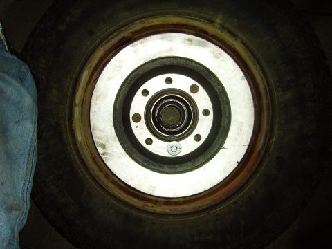 1991 Ford Bronco - Close-up view of a vehicle's wheel hub and brake rotor assembly.