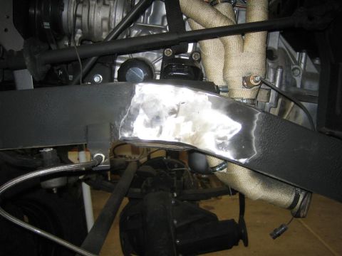 1987 Suzuki Samurai - A close-up view shows a section of a vehicle's frame that has been welded and polished.