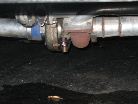 2001 Pontiac Trans Am - Close-up view of a turbocharger and exhaust system components.