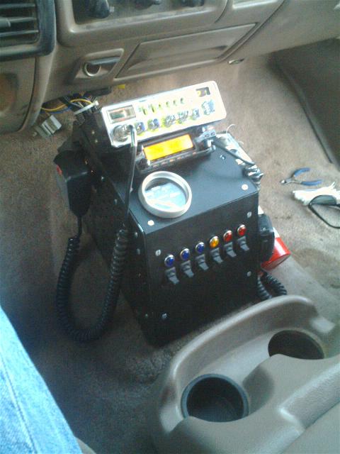 1994 Ford Bronco - Custom CB radio and switch panel installed in the interior of a vehicle.