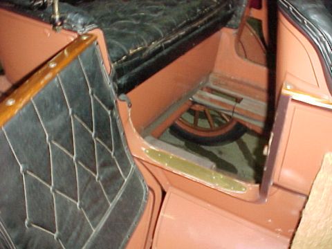 1912 Ford Model T - Interior view of a 1912 Ford Model T, showing its distinctive upholstery and spare tire.