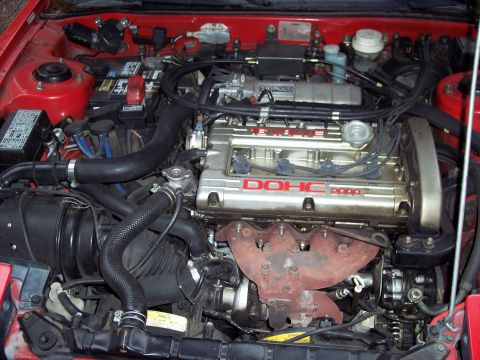 1991 Mitsubishi Eclipse - Engine bay a DOHC 2000 badge and turbocharger, likely from a Mitsubishi vehicle.