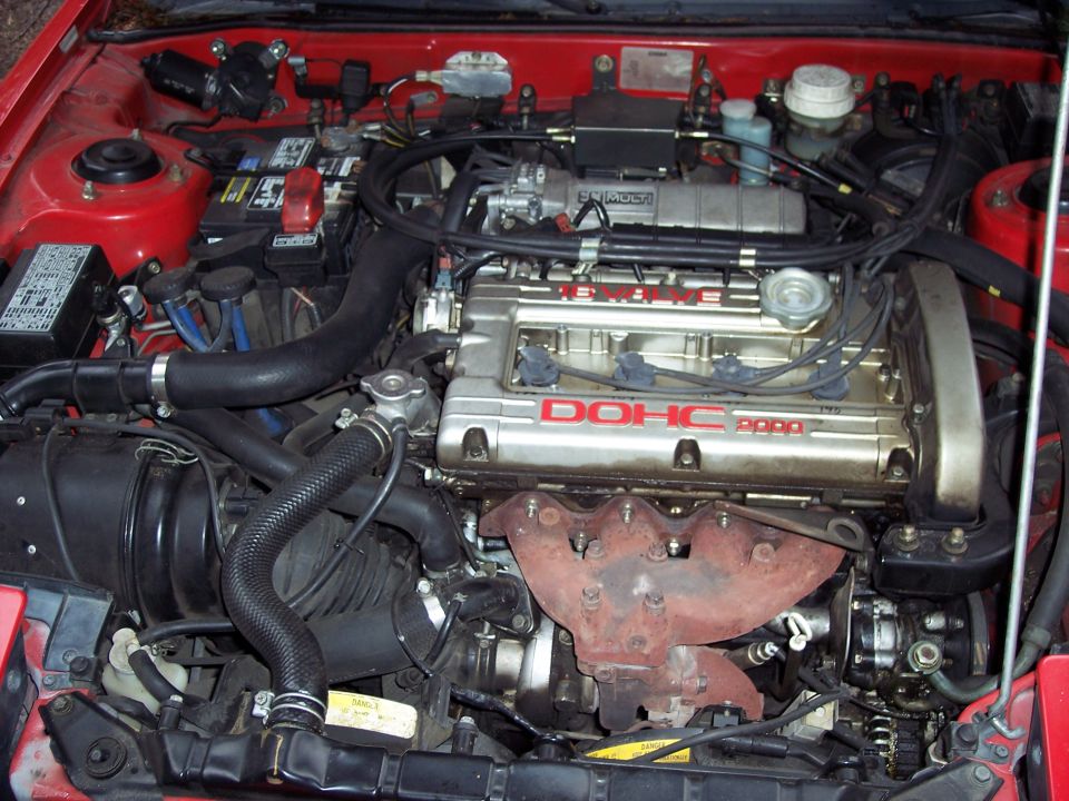 Engine bay with DOHC 2000 badge and turbocharger