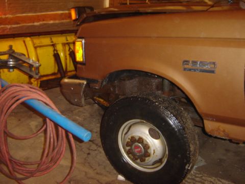 1992 Ford Bronco - This Ford F-350 truck is equipped with a snow plow and appears to be a model from the early 1990s.