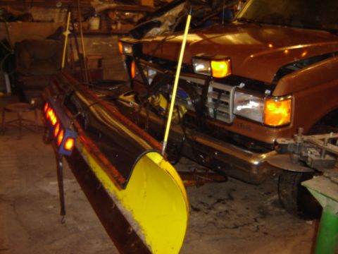 1992 Ford Bronco - This 1992 Ford Bronco is equipped with a yellow and black snow plow.
