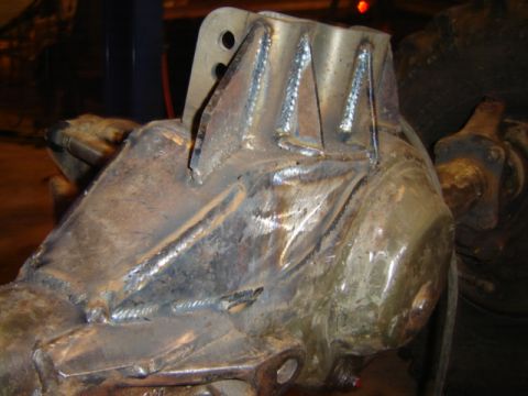 1992 Ford Bronco - This heavily modified metal part shows extensive welding and fabrication work, suggesting it's a custom component.