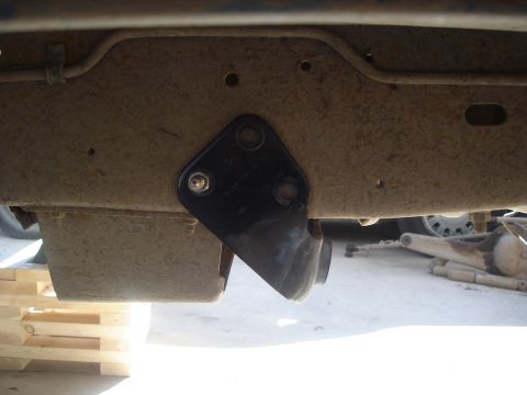 1990 Ford Bronco - A close-up view of a frame-mounted bracket, likely part of a suspension or accessory system.