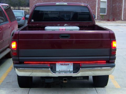 2001 Dodge 1500 - This pickup truck features a chrome bumper and a red LED light strip across the tailgate.