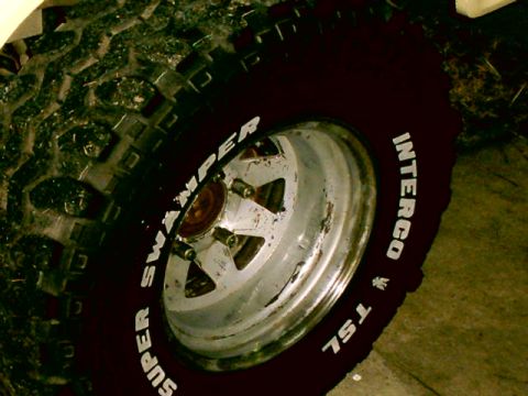 Close-up of a Super Swamper TSL tire on a chrome wheel