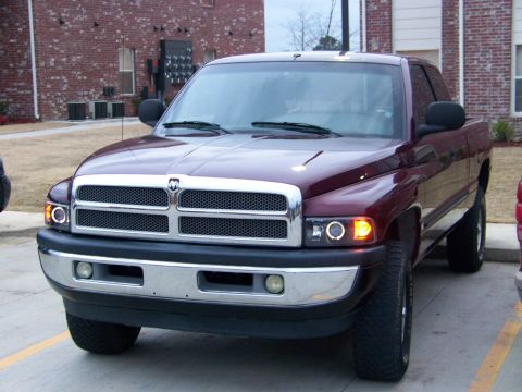 2001 Dodge 1500 - Front view of a maroon 2001 Dodge 1500 pickup truck parked outdoors.