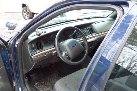 2001 Ford Crown Victoria - Interior view of a 2001 Ford Crown Victoria, highlighting the dashboard and driver's area.