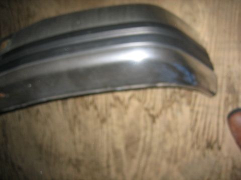 1994 Ford Bronco - This is a close-up view of a car bumper part, likely a corner piece.