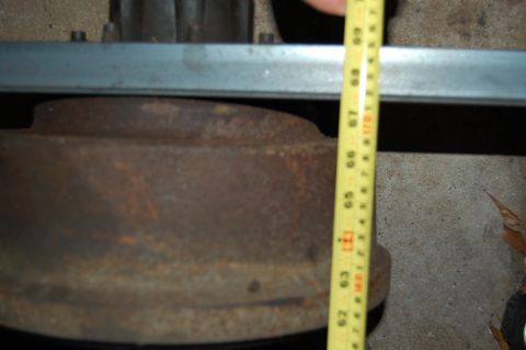1994 Ford Bronco - Measuring a brake drum, likely for a vehicle part replacement.