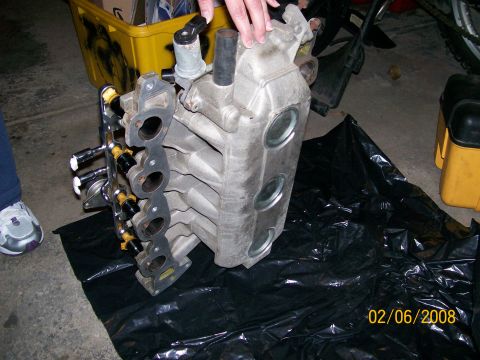 1995 Mercury Grand Marquis - This intake manifold, likely from a V8 engine, is shown with its fuel injectors.