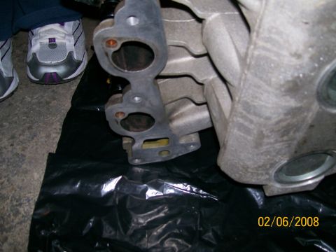 1995 Mercury Grand Marquis - Close-up view of an intake manifold gasket, likely removed for repair or replacement.