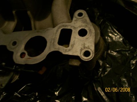 1995 Mercury Grand Marquis - Close-up of an intake manifold gasket with visible wear marks.
