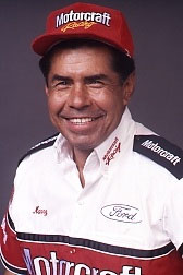 1968 Ford Mustang - A man smiles while wearing a Motorcraft Racing hat and shirt with Ford branding.
