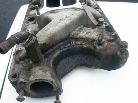 1984 Ford Bronco - This intake manifold has visible "Edelbrock" branding and appears to be used.