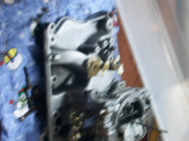 Intake manifold on a blue blanket with snowman pattern