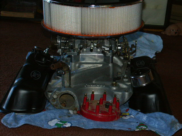 Engine block with air filter, carburetor, and distributor cap
