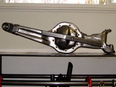 1996 Ford Bronco - A polished metal rear axle differential housing is shown from the side.