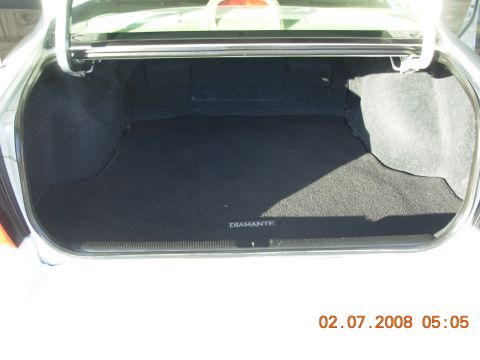 1995 Ford Taurus - The trunk interior shows the word "DIAMANTE" on the floor mat. A date stamp is visible in the lower right corner.
