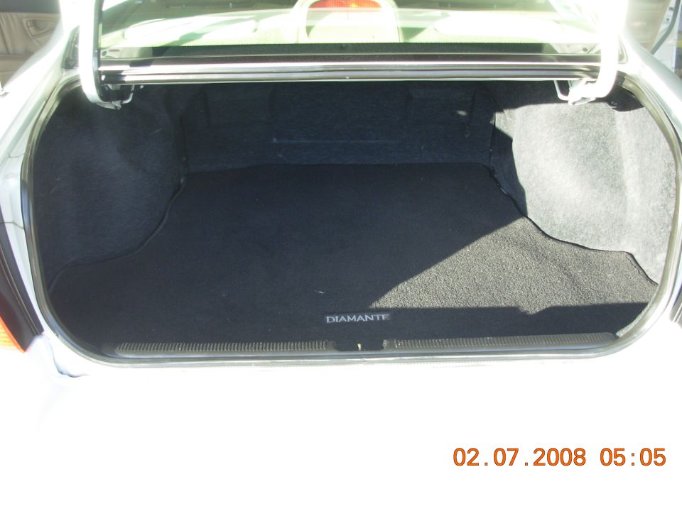 Car trunk interior with "DIAMANTE" text on the mat. Date stamp reads 02.07.2008
