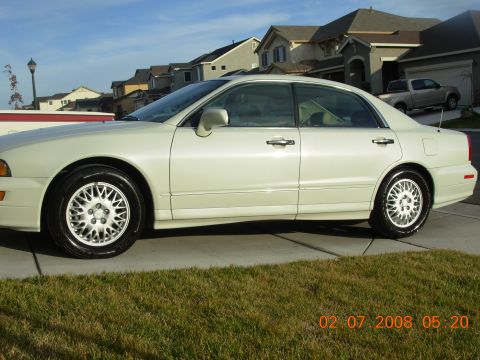 1995 Ford Taurus - This white sedan is parked in a suburban driveway. The timestamp indicates it was photographed on February 7, 2008.