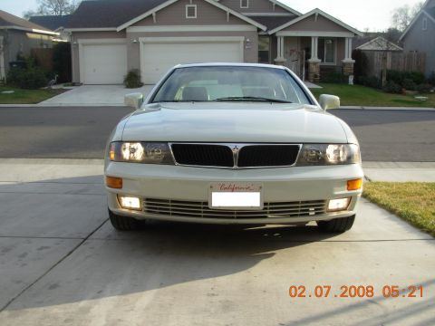 1995 Ford Taurus - A white Mitsubishi Diamante is parked in front of a suburban house. The date stamp indicates the photo was taken on February 7, 2008.