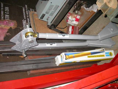 1990 Ford Bronco - Cage arms with old style mounts, Bilstein 5150 14" travel shocks.