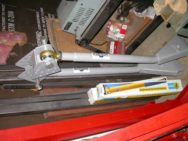 Cage arms with old style mounts, Bilstein 5150 14" travel shocks.