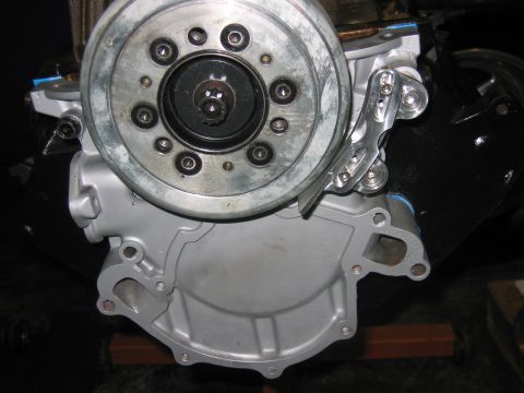 1992 Ford Mustang - Close-up view of an engine's water pump and pulley system, showing mechanical parts.