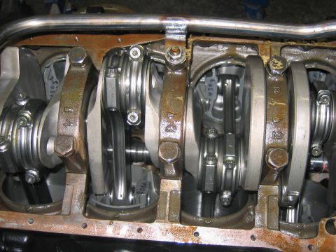 1992 Ford Mustang - Close-up view of an engine's internal components, showing the crankshaft and connecting rods.