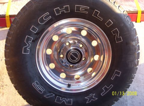 1995 Ford Bronco - Close-up of a Michelin tire mounted on a chrome wheel, with a date stamp visible in the lower right corner.