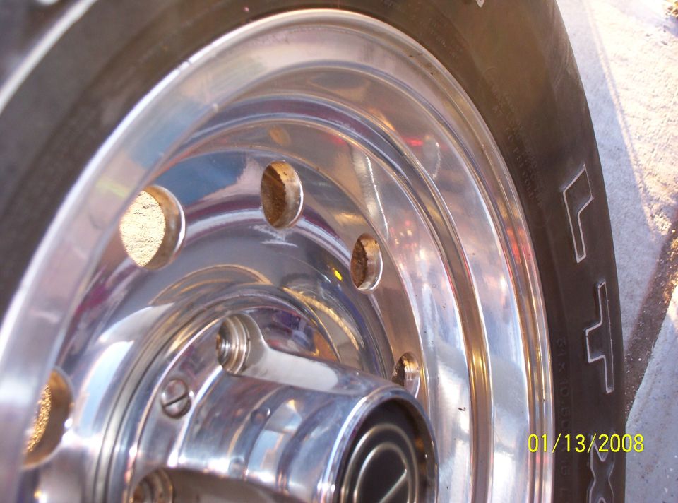 Close-up of a chrome wheel with a tire. Date stamp shows 01/13/2008