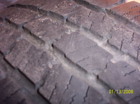1995 Ford Bronco - The tire tread shows significant wear and cracking, with a date stamp of 01/13/2008 visible.
