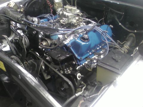 1978 Ford Bronco - Close-up view of a vehicle's engine compartment, showing various mechanical components and wiring.