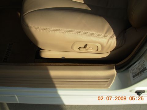 1995 Ford Taurus - Interior view of a car seat, with a "DIAMANTE" floor mat partially visible on the driver's side.