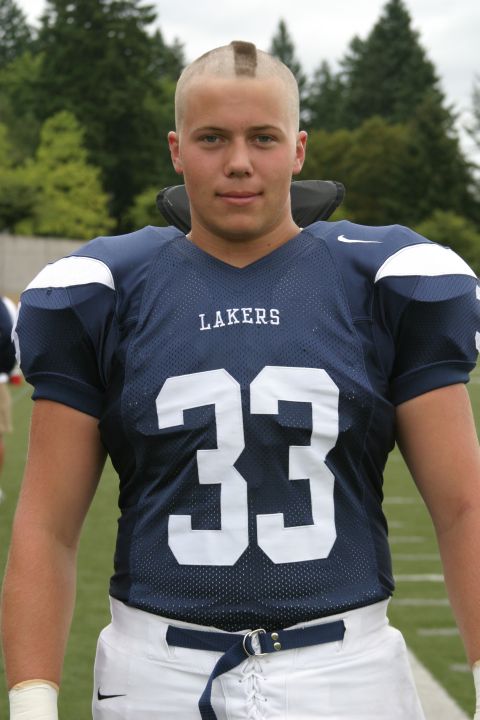 1993 Ford Bronco - Football player with a mohawk wearing a blue jersey with 'LAKERS' and number 33.
