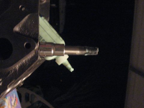 1965 Ford Galaxie - A socket wrench is shown engaging a threaded shaft, likely a component of a vehicle's steering system.