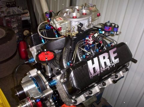 1992 Ford Mustang - Custom V8 engine with HRE branding on valve cover and Holley carburetor.