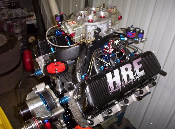 Custom V8 engine with HRE branding on valve cover and Holley carburetor